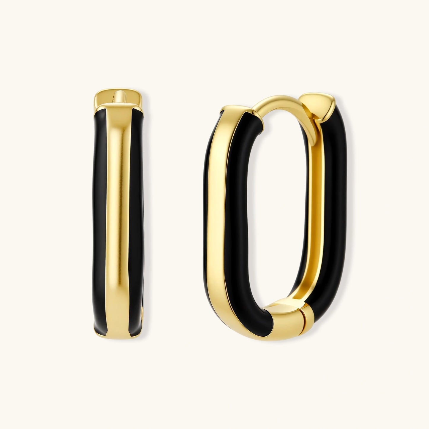 Modern hoop earrings with gold-plated and black sections, featuring hinged closure on white background.